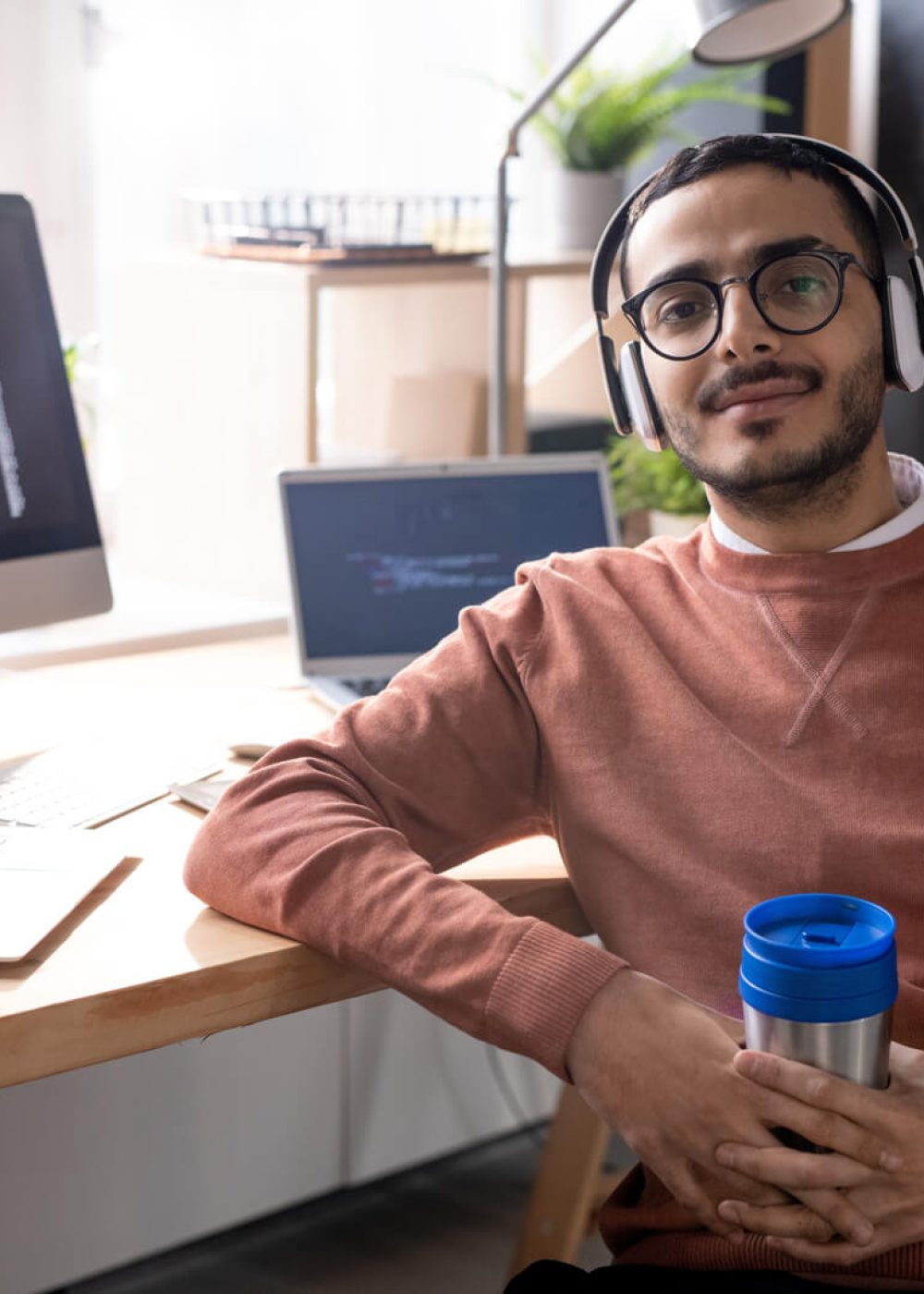 handsome-programmer-in-headphones-listening-to-mus-2023-11-27-04-56-48-utc